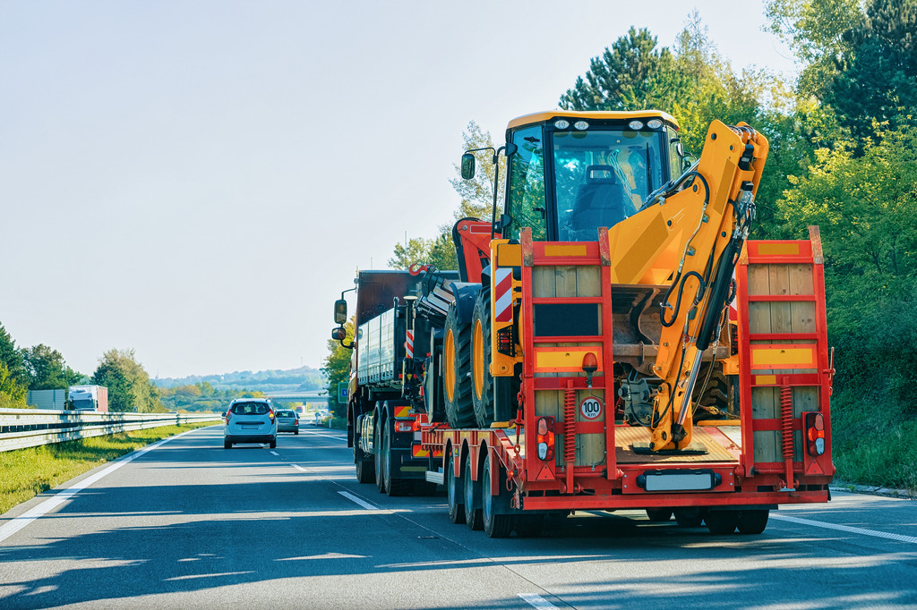 Transporting an excavator by truck